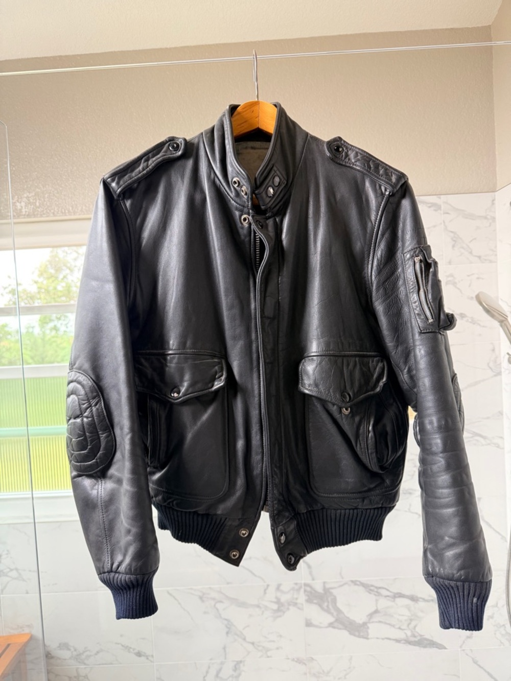 Vintage 1970s black leather motorcycle jacket, size 42